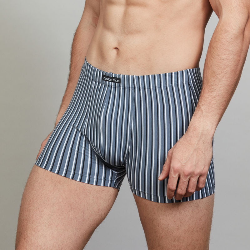 Model wears Cotton Stretch Mens Trunk in CHINA BLUE BLACK AND WHITE STR. On body side view