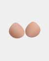Model wears Reusable Nursing Pads in Nude. On body front view