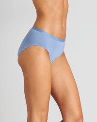 Model wears Body Cotton High Cut Brief Twin Pack in COLONY BLUE/LANTANA. On body side view