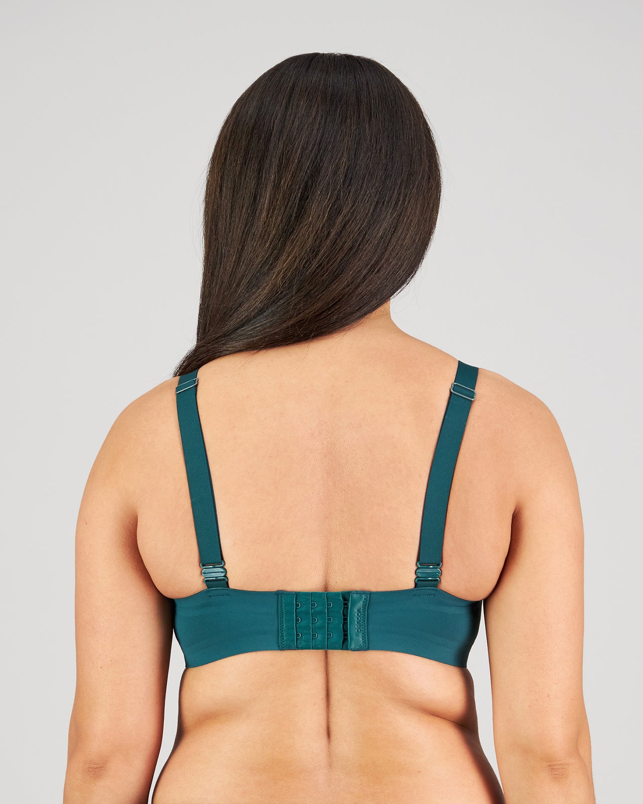 Model wears Comfit Collection Wire Free Bra in RAIN FOREST. On body back view