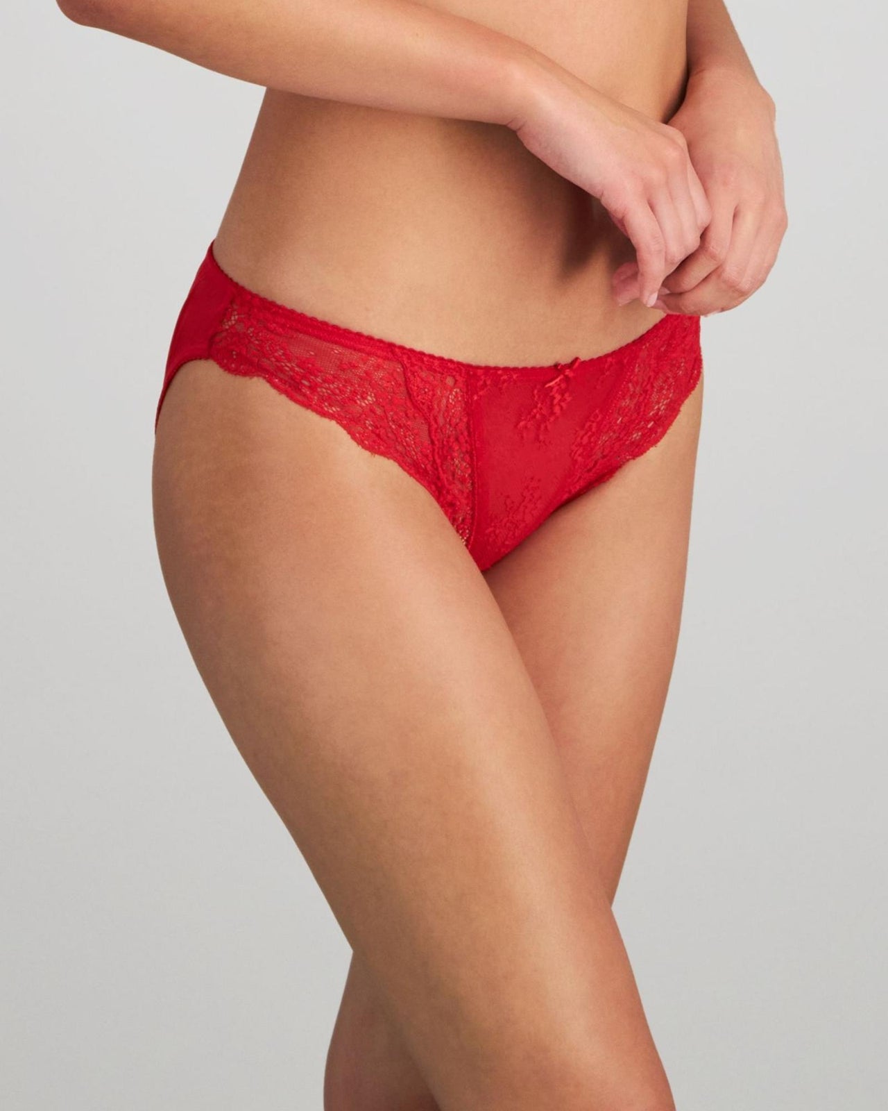 Model wears Sofia Bikini in SALSA. On body side view