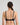 Model wears Simply Seamless Wire Free Bra in BLACK. On body back view