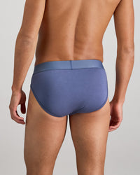 Model wears Bamboo Mens Brief in VINTAGE INDIGO. On body back view