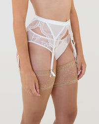 Model wears Una Elegance Suspender in SUGAR. On body side view