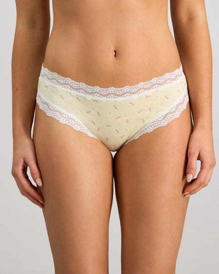 Model wears Daily Micro Bikini in TRANSPARENT YELLOW. On body front view