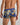 Model wears Retros Print Mens Trunk in WILD CAMO PRINT. On body back view
