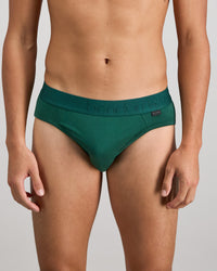 Model wears Bamboo Mens Brief in RAIN FOREST. On body front view