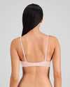 Model wears Simply Seamless Wire Free Bra in SILVER PINK. On body back view