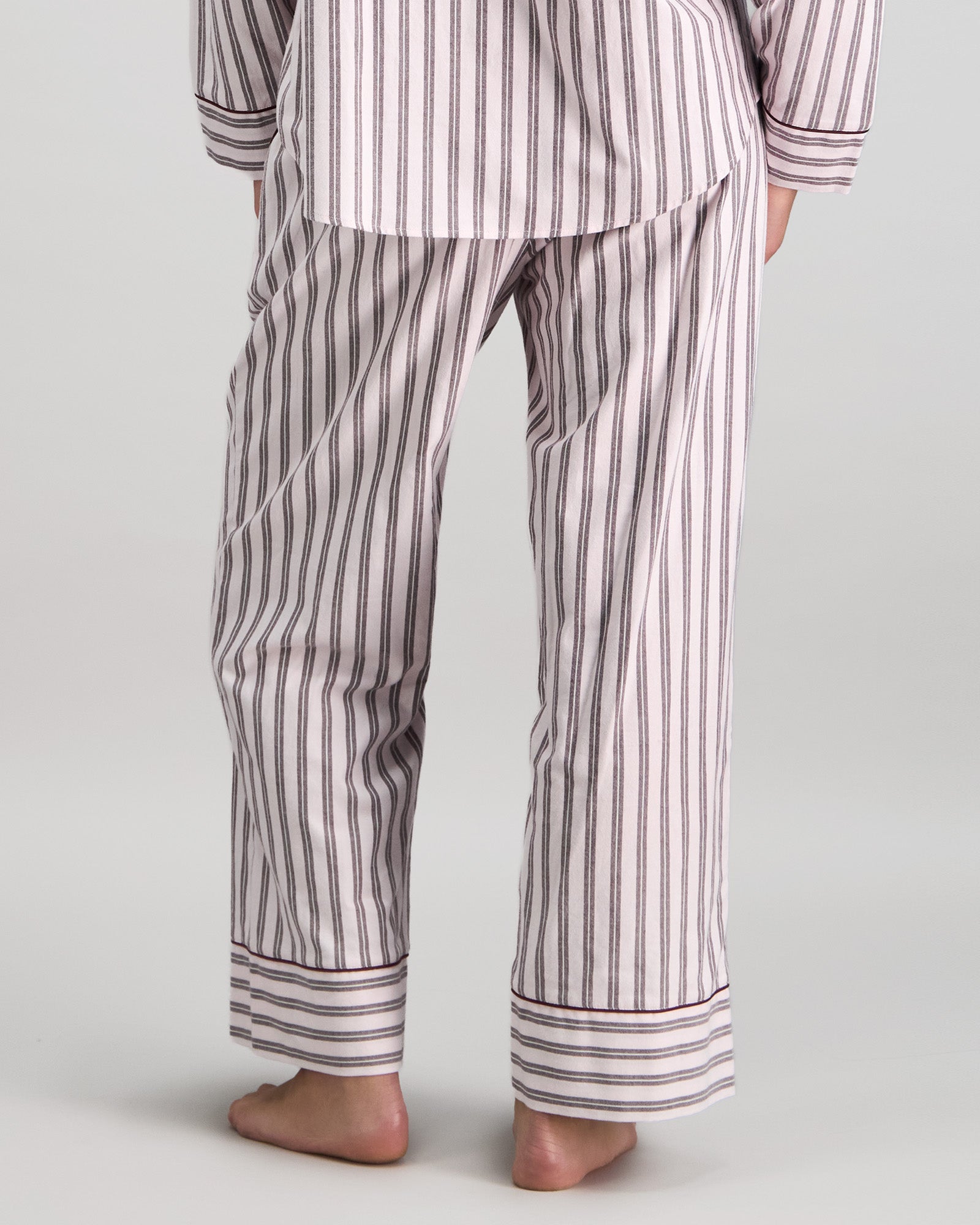 Model wears Cosy Flannel Long Pj Pant in PINK-A-BOO. On body back view