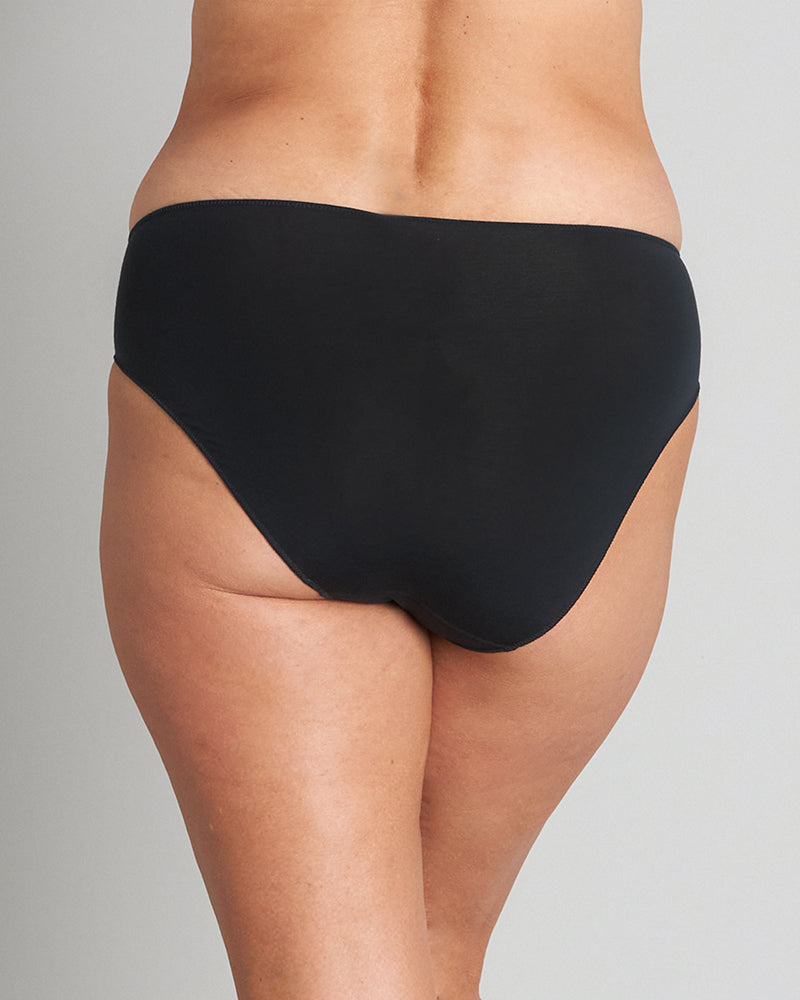 Model wears Au Naturel High Cut Brief in BLACK. On body back view