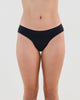 Model wears Seamless Soft Bikini in BLACK. On body front view