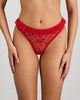 Model wears Tinsel Tease Thong in SALSA. On body front view