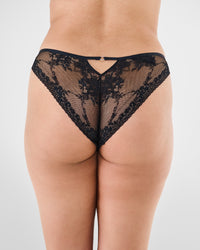 Model wears Niara Bikini in BLACK. On body back view