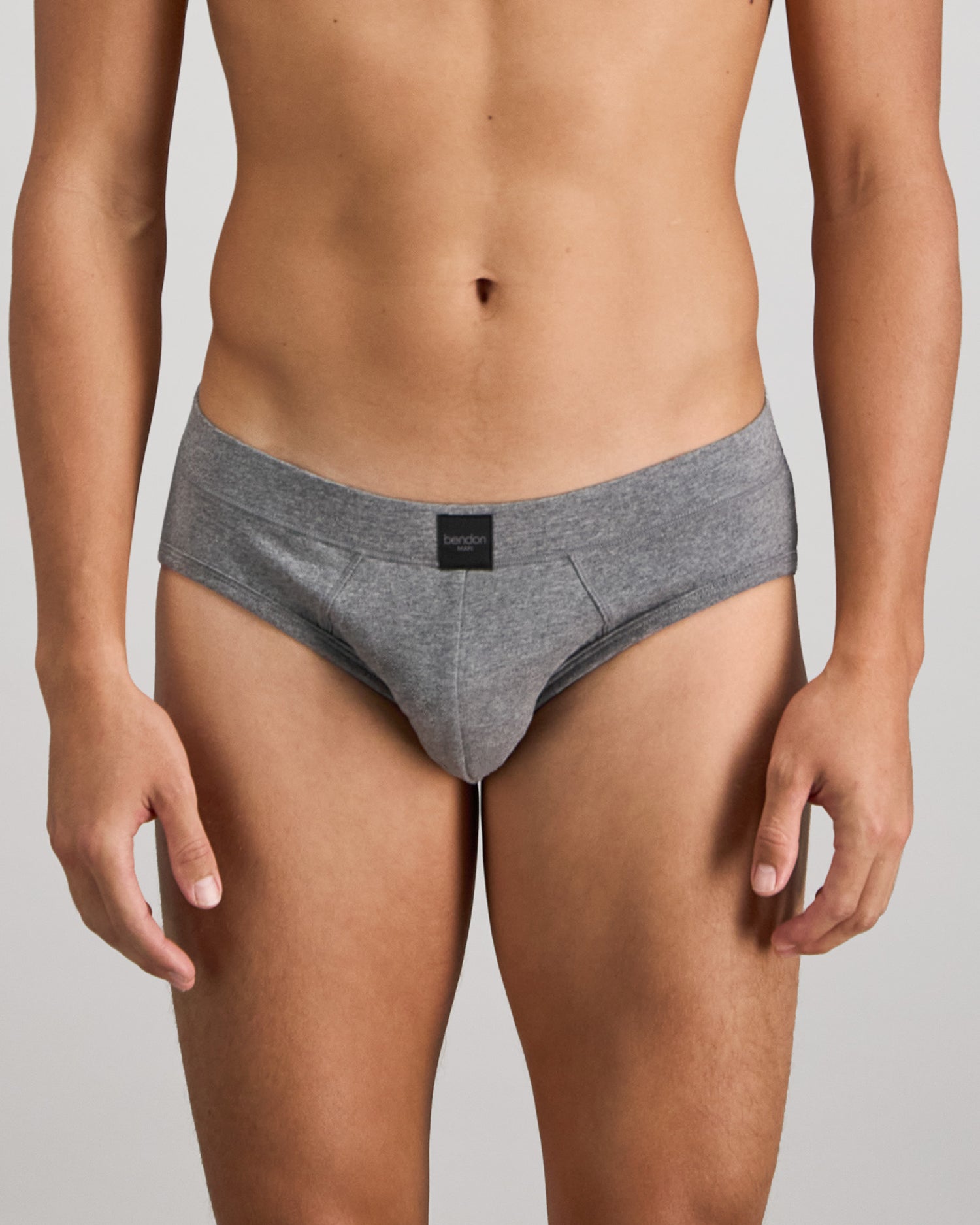 Model wears High Tech Cotton Mens Brief in GREY MARL. On body front view