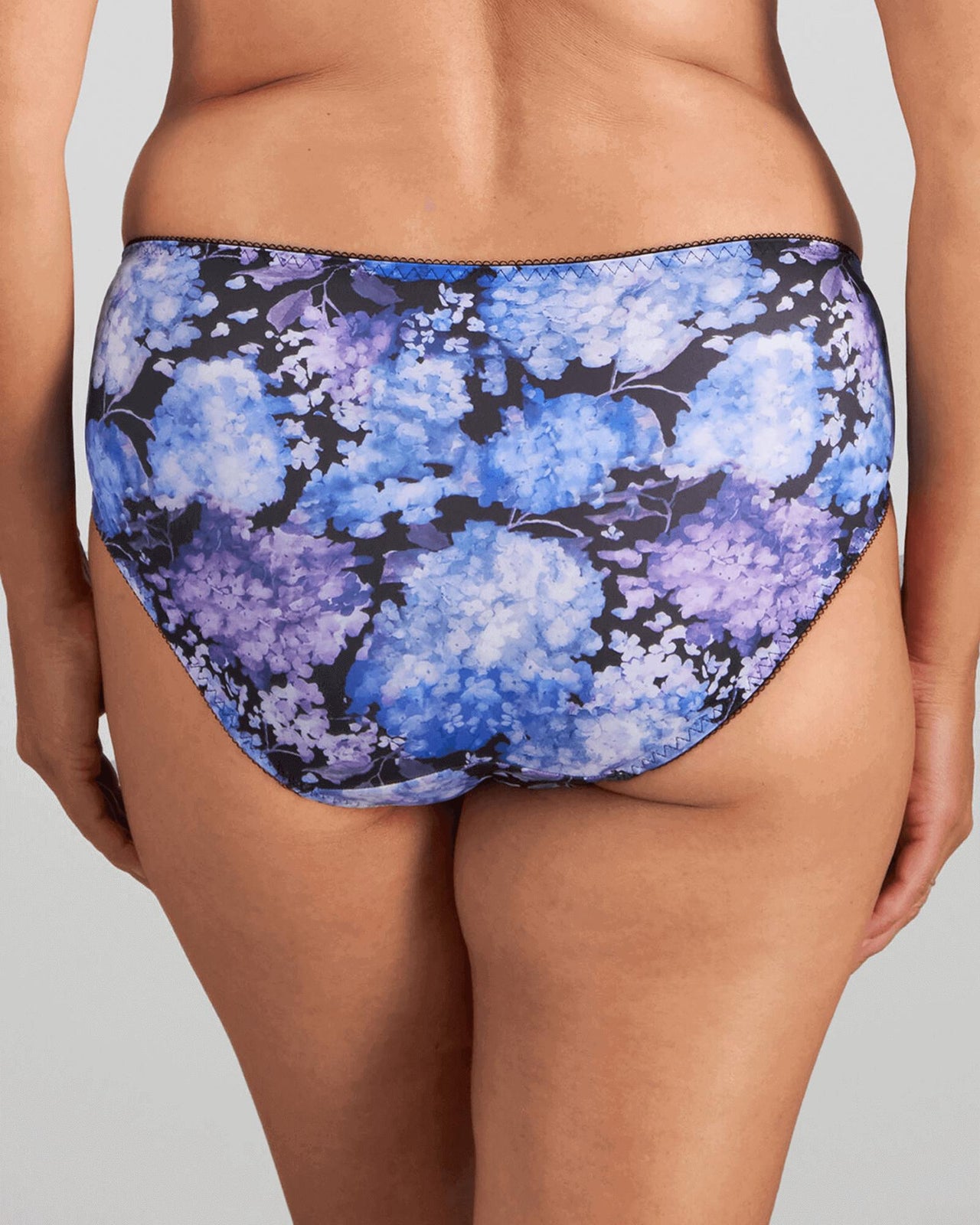 Model wears Wild Violet Full Brief in BLUE HYDRANGEA PRINT. On body back view