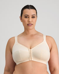 Model wears Ultimate Comfort Front Closure Wire Free Front Opening Bra in PINK CHAMPAGNE. On body front view
