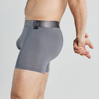 Model wears Bamboo Mens Trunk in ASH. On body side view