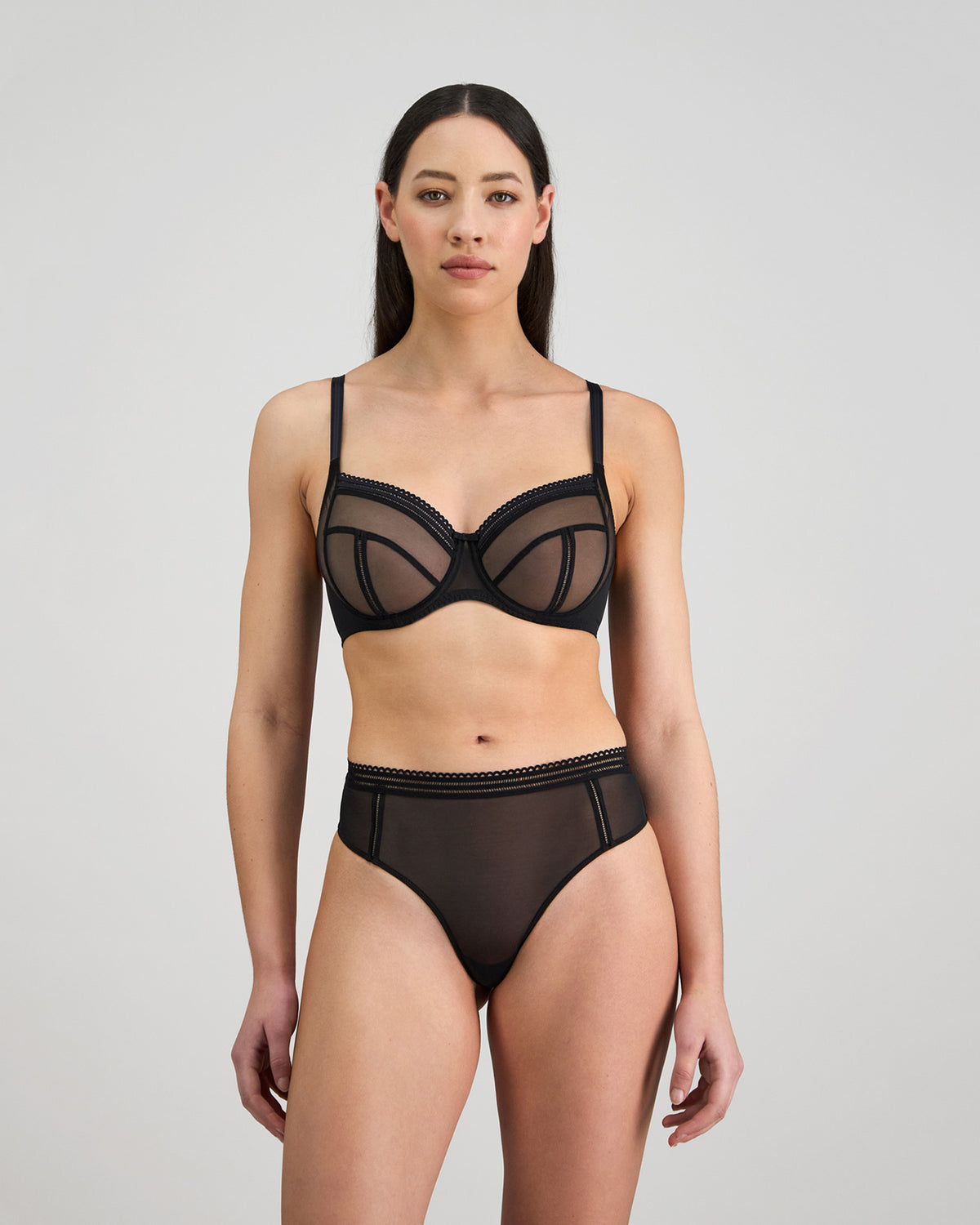 Sheer Essence Thong in BLACK. Flat lay back view