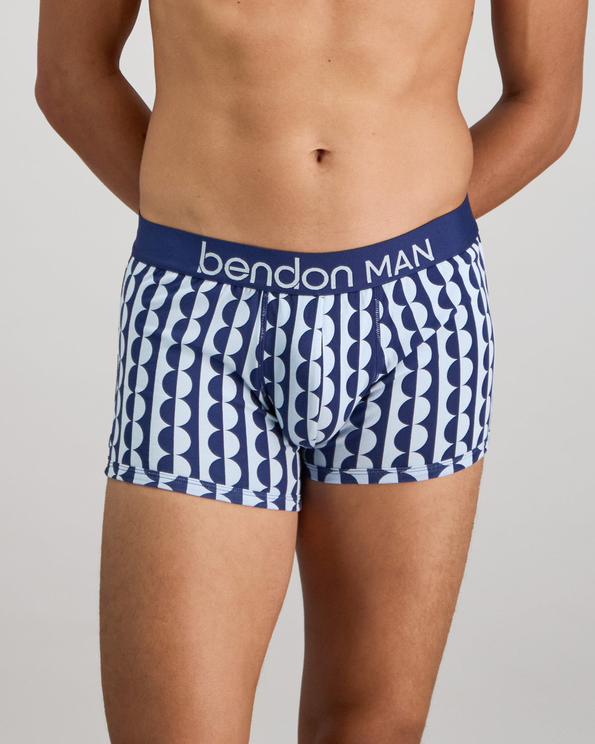 Model wears Retros Print Mens Trunk in OTHELLO PRINT. On body front view