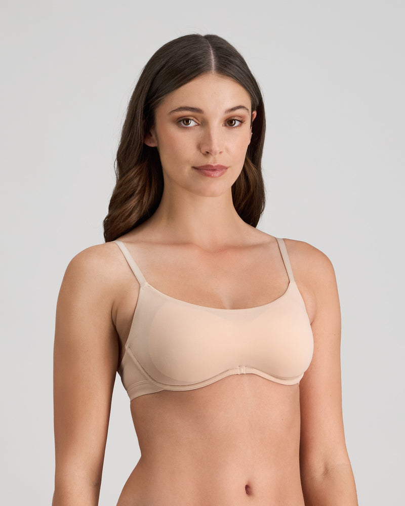 Model wears Extra-Ordinary Contour Bra in LATTE. On body side view
