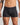 Model wears Cotton Stretch Mens Trunk in BLACK PINSTRIPE. On body front view