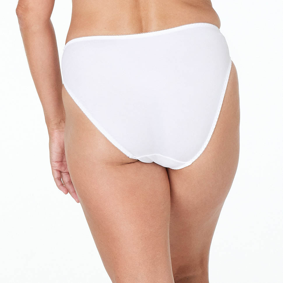 Model wears Coral High Cut Brief in WHITE. On body back view