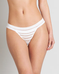 Model wears Morning Lola Thong in WHITE. On body front view