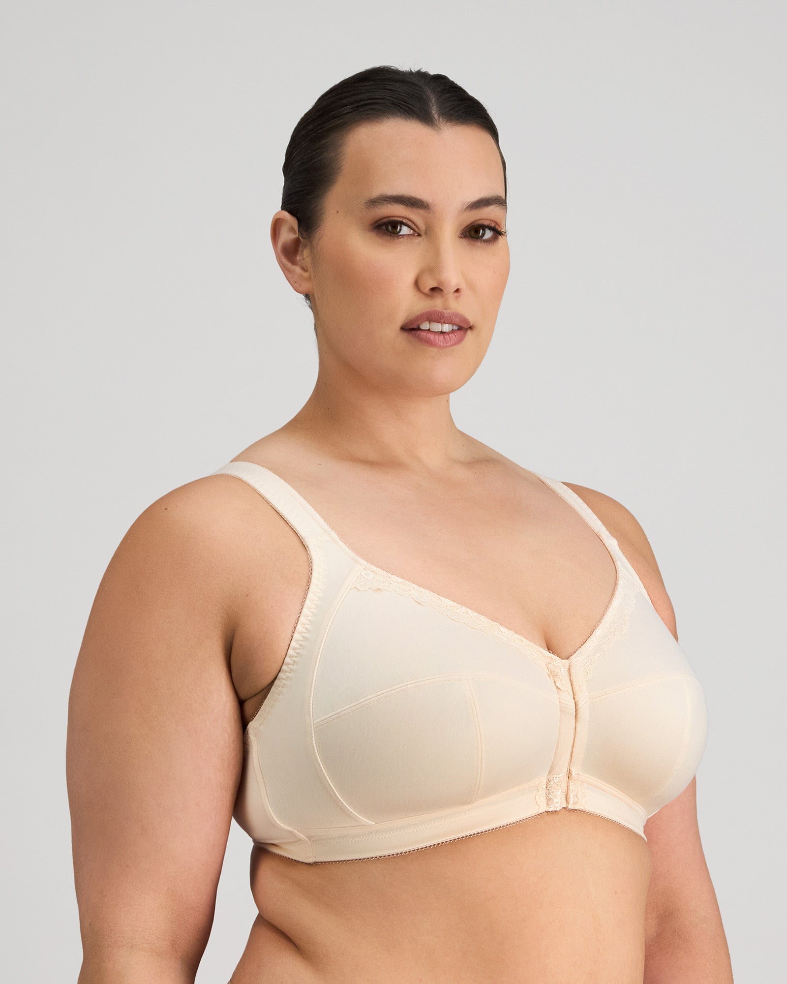 Model wears Ultimate Comfort Front Closure Wire Free Front Opening Bra in PINK CHAMPAGNE. On body side view
