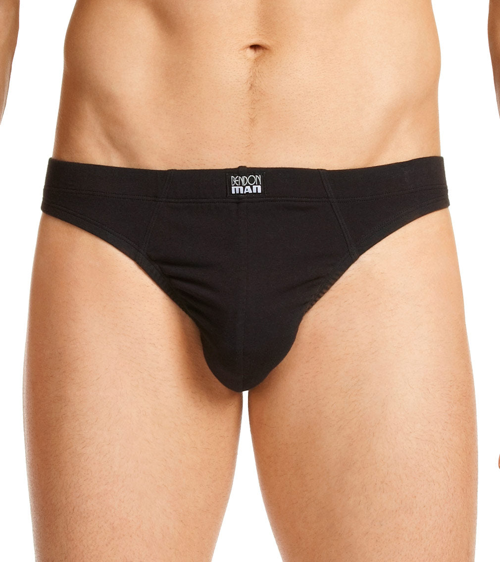 Model wears Cotton Stretch Mens Thong in BLACK. On body front view