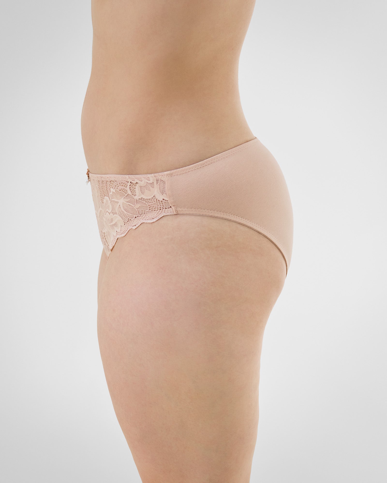 Model wears Embrace Bikini in LATTE. On body side view