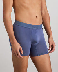 Model wears Bamboo Mens Trunk in VINTAGE INDIGO. On body side view