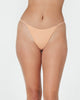Model wears Clemence Thong in LATTE. On body front view