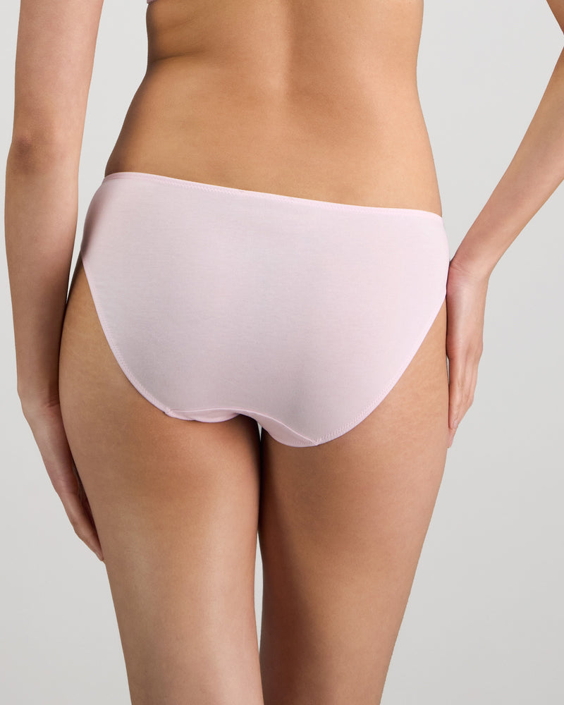 Model wears Embrace Bikini in FESTIVAL BLOOM. On body back view