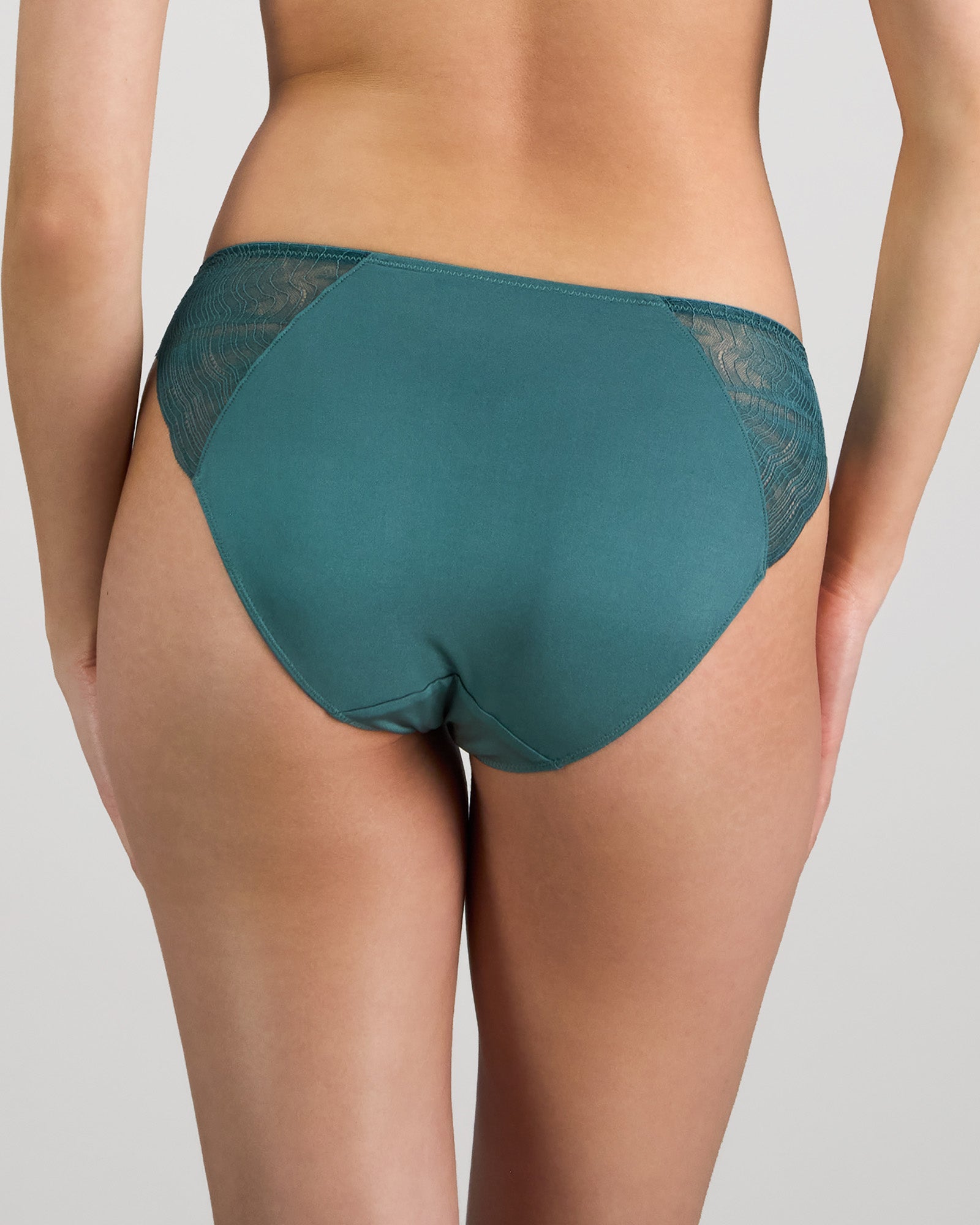 Model wears Coco Divine Bikini in MEDITERRANEA. On body back view