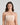 Model wears Extra-Ordinary Bandeau in LATTE. On body front view