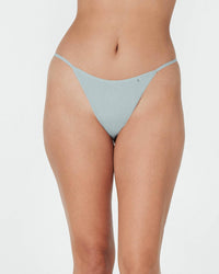 Model wears Clemence Thong in SLATE. On body front view