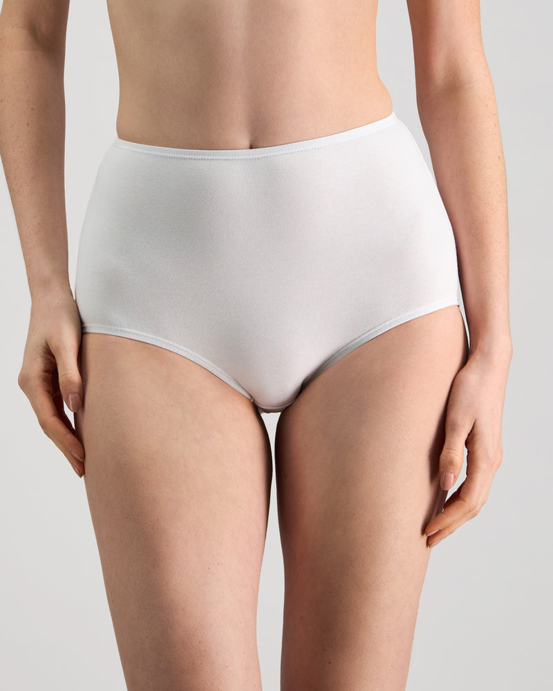 Model wears Freestyle Full Brief in WHITE. On body front view