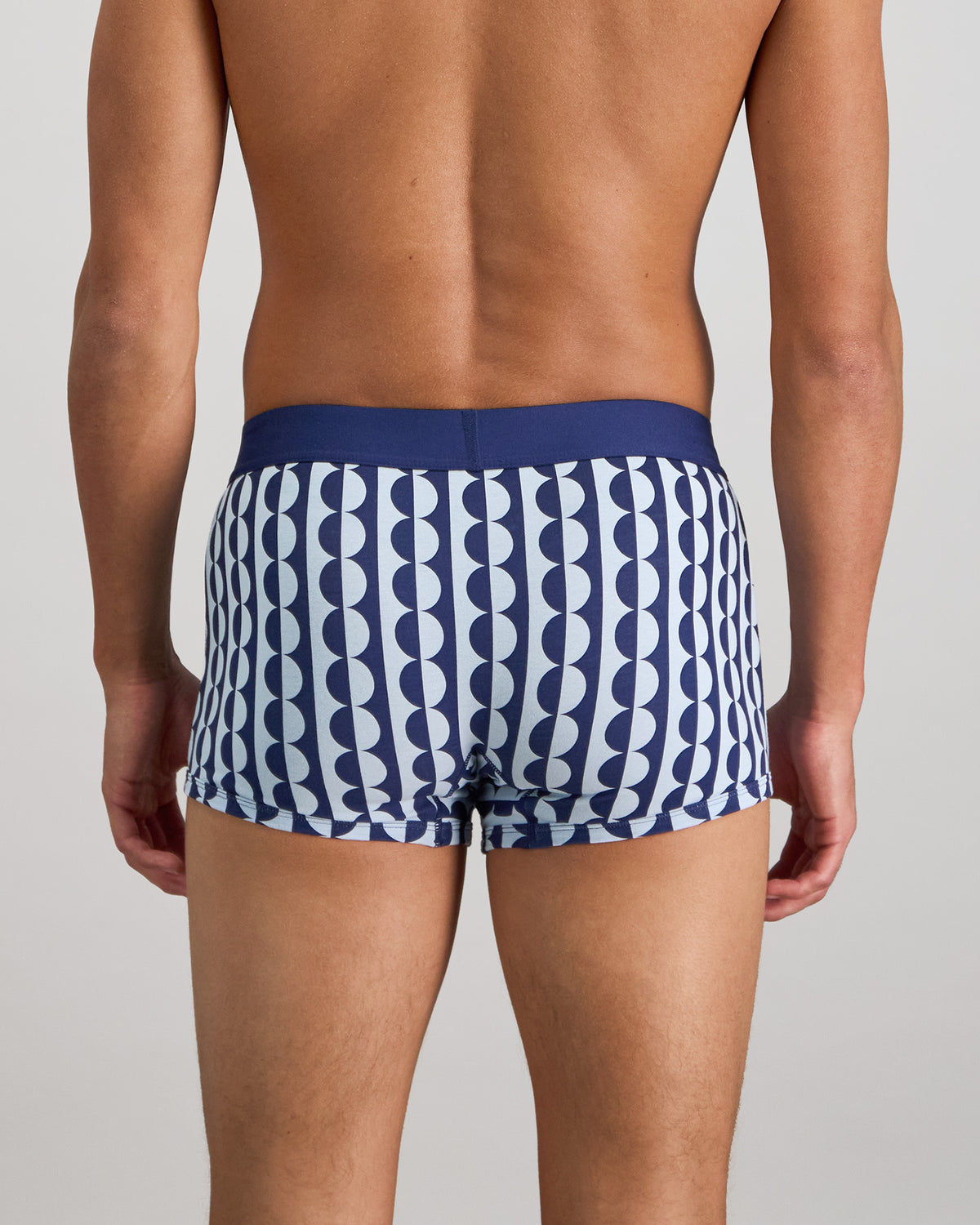 Model wears Retros Print Mens Trunk in OTHELLO PRINT. On body back view