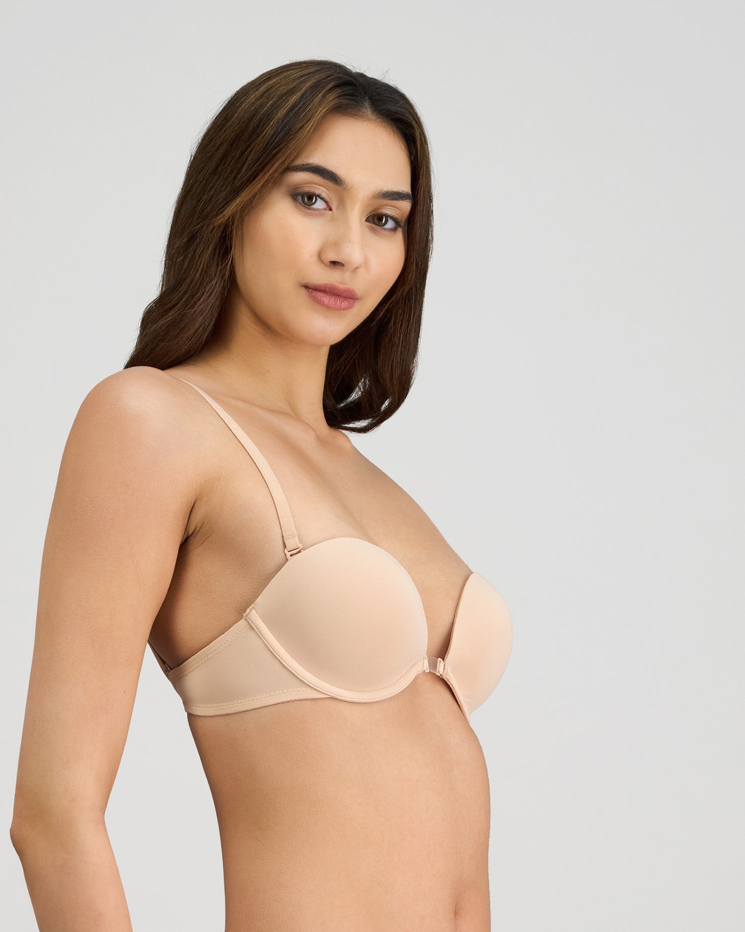 Model wears Infinity Multiway Convertible Bra in LATTE. On body side view