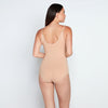 Model wears Medium Control Bodysuit in CARAMEL. On body back view