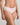 Model wears Simply Seamless Boyshort in ICY PINK/WHITE STRIPE. On body side view