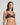 Model wears Niara Underwire Bra in BLACK/BEAUJOLAIS. On body side view