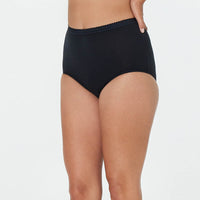 Model wears Freedom Full Brief in BLACK. On body side view