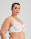 Model wears Coral Underwire Bra in WHITE. On body side view