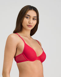 Model wears Skinlite Underwire Bra in JAZZY. On body side view