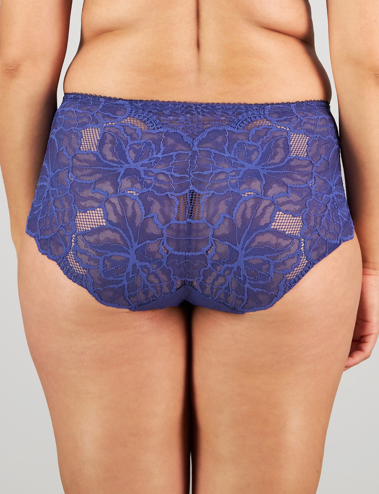 Model wears Midnight Express Full Brief in BLUE RIBBON. On body back view