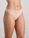 Model wears Extra-Ordinary Thong in LATTE. On body side view