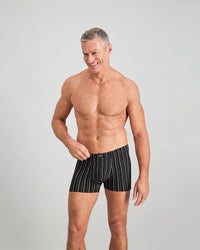Model wears Cotton Stretch Mens Trunk in BLACK WHITE. On body front view