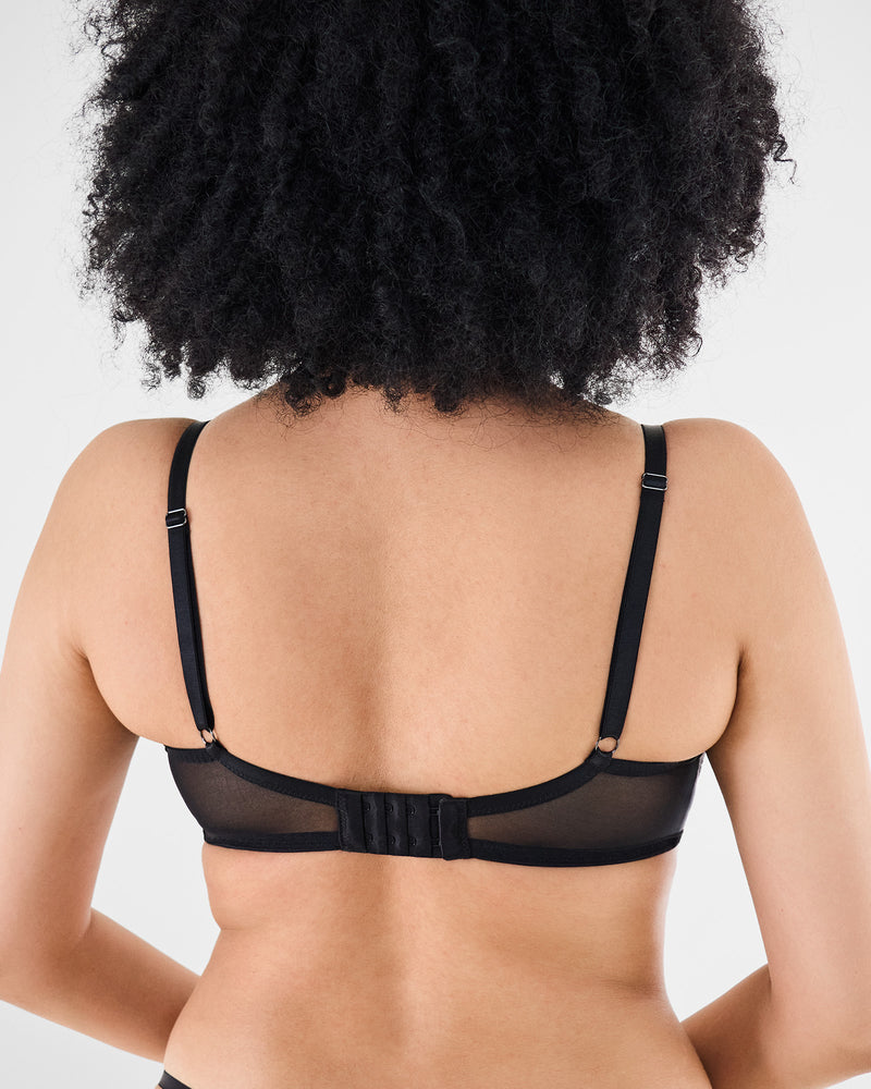 Model wears Romilly Underwire Bra in BLACK. On body back view