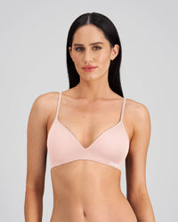 Model wears Simply Seamless Wire Free Bra in SILVER PINK. On body front view